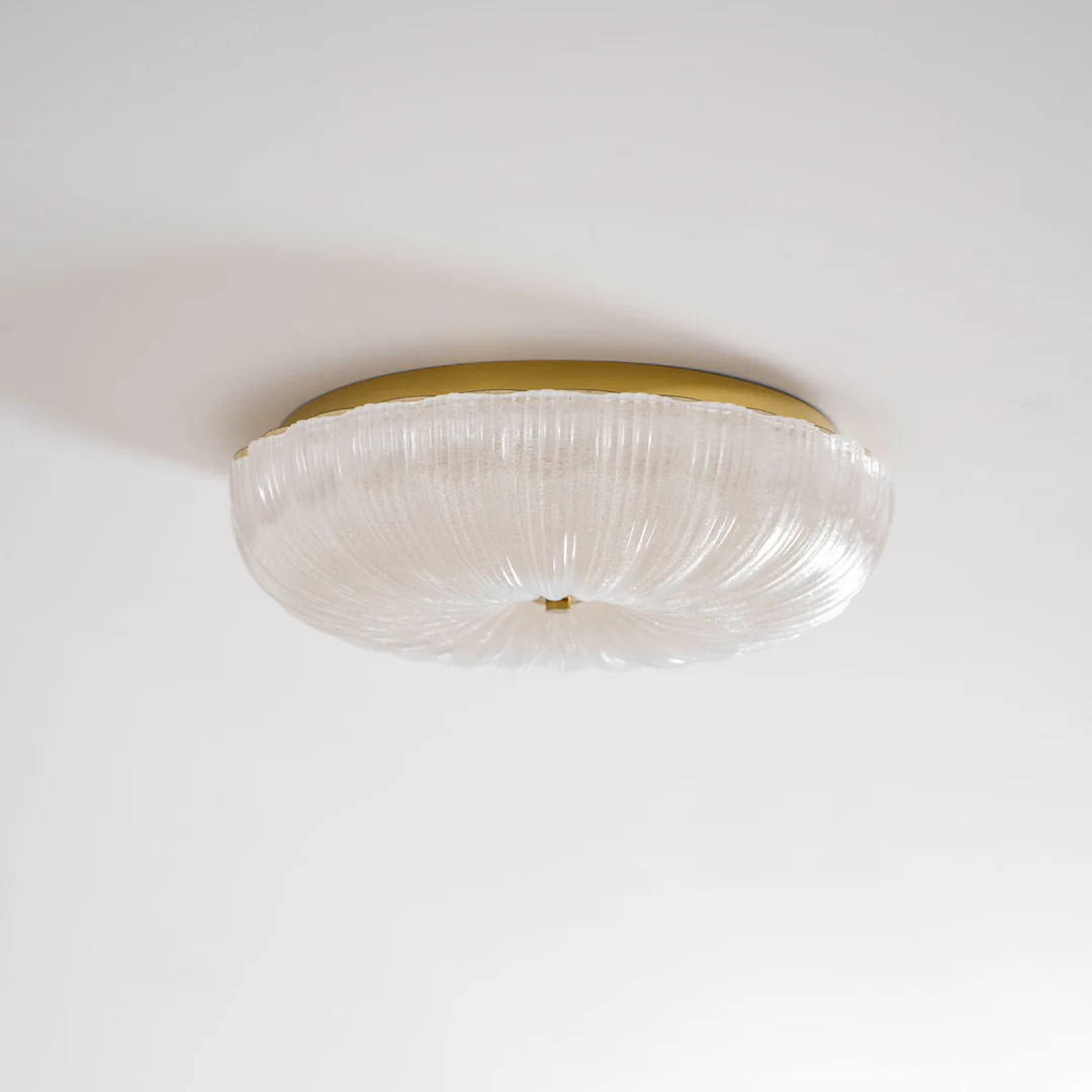 Ripple side profile below a gold-coloured ceiling plate
