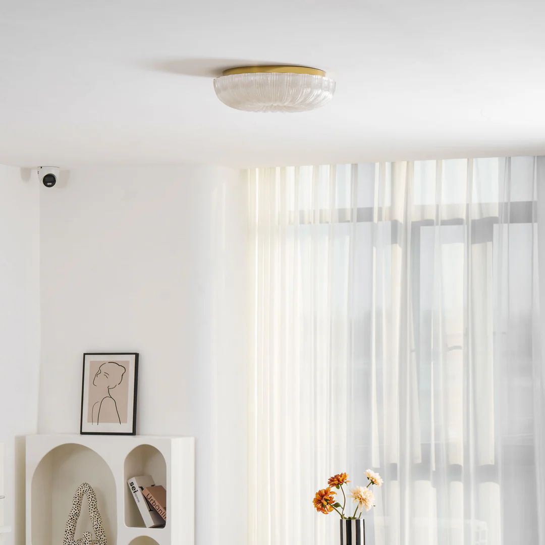 Round Ripple fixture near white window curtains