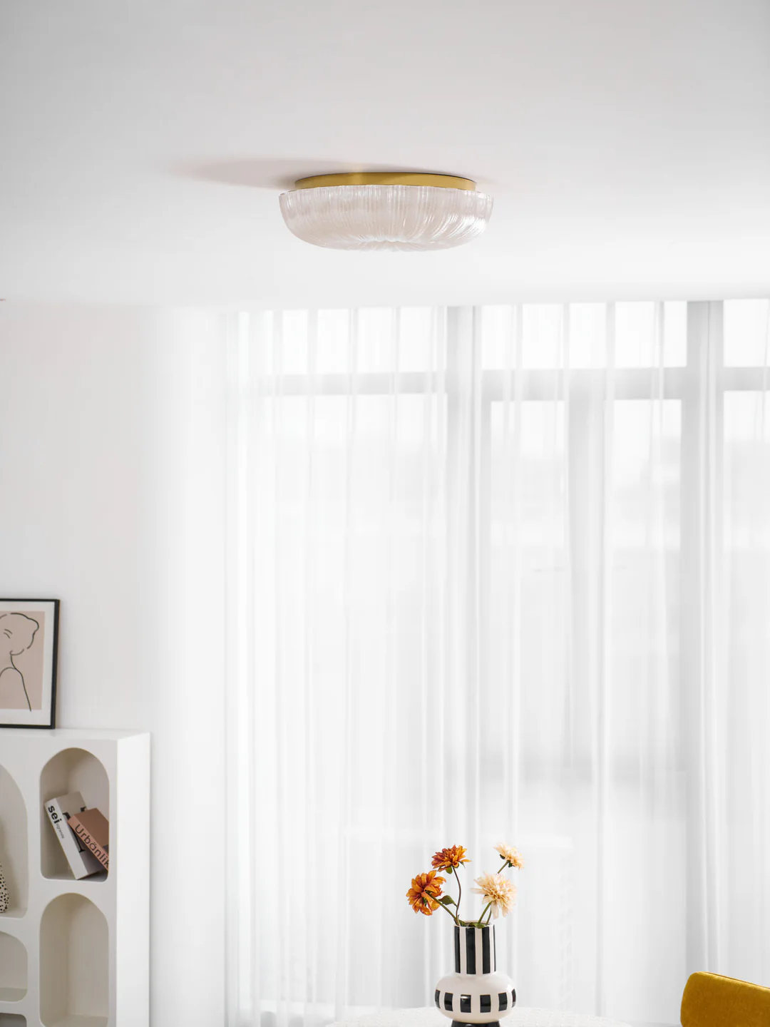 Shallow glass light close to a white ceiling