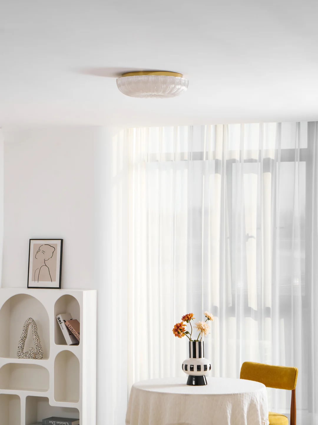 Ripple gold-trim ceiling light in a pale interior
