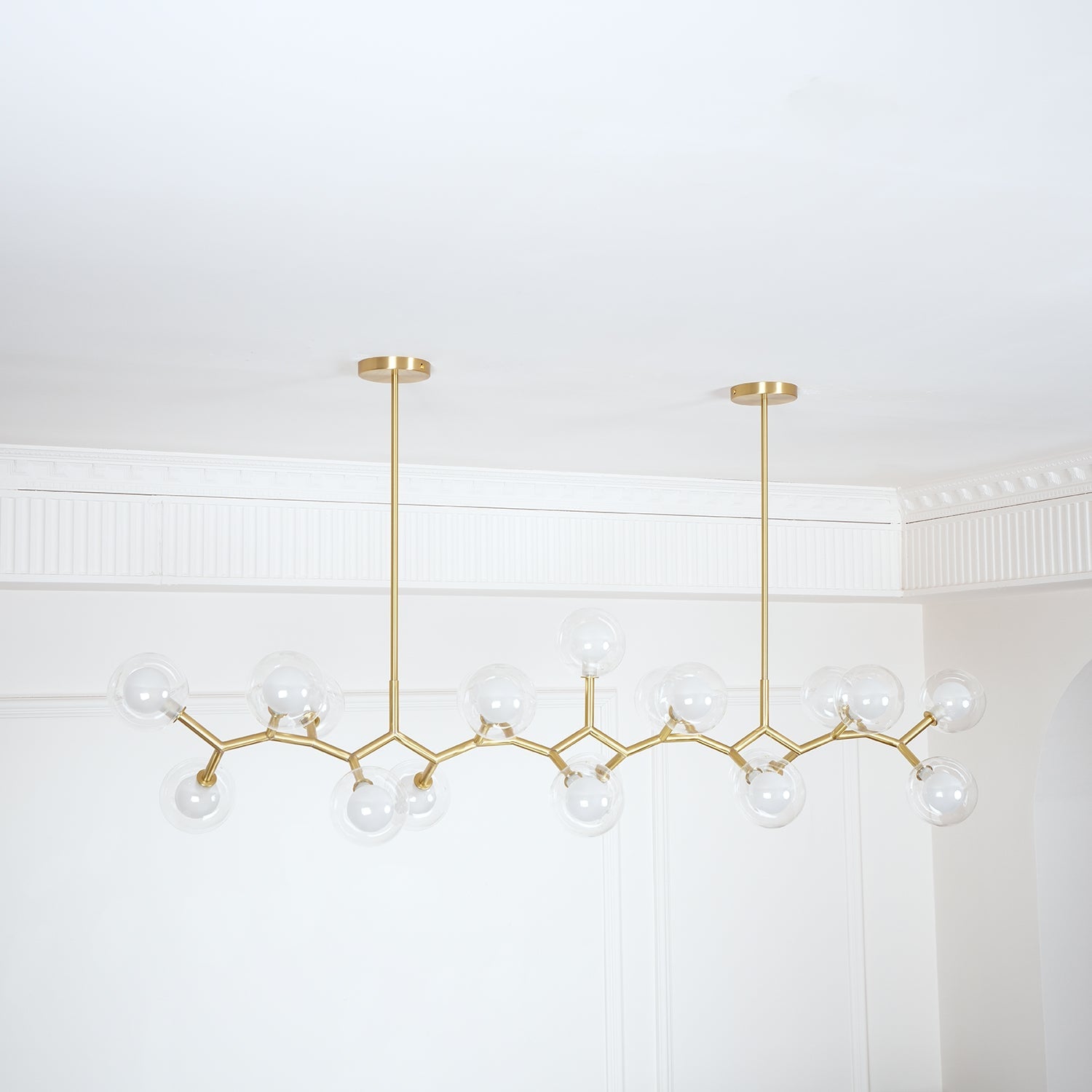 Unlit branching chandelier with multiple round glass shades