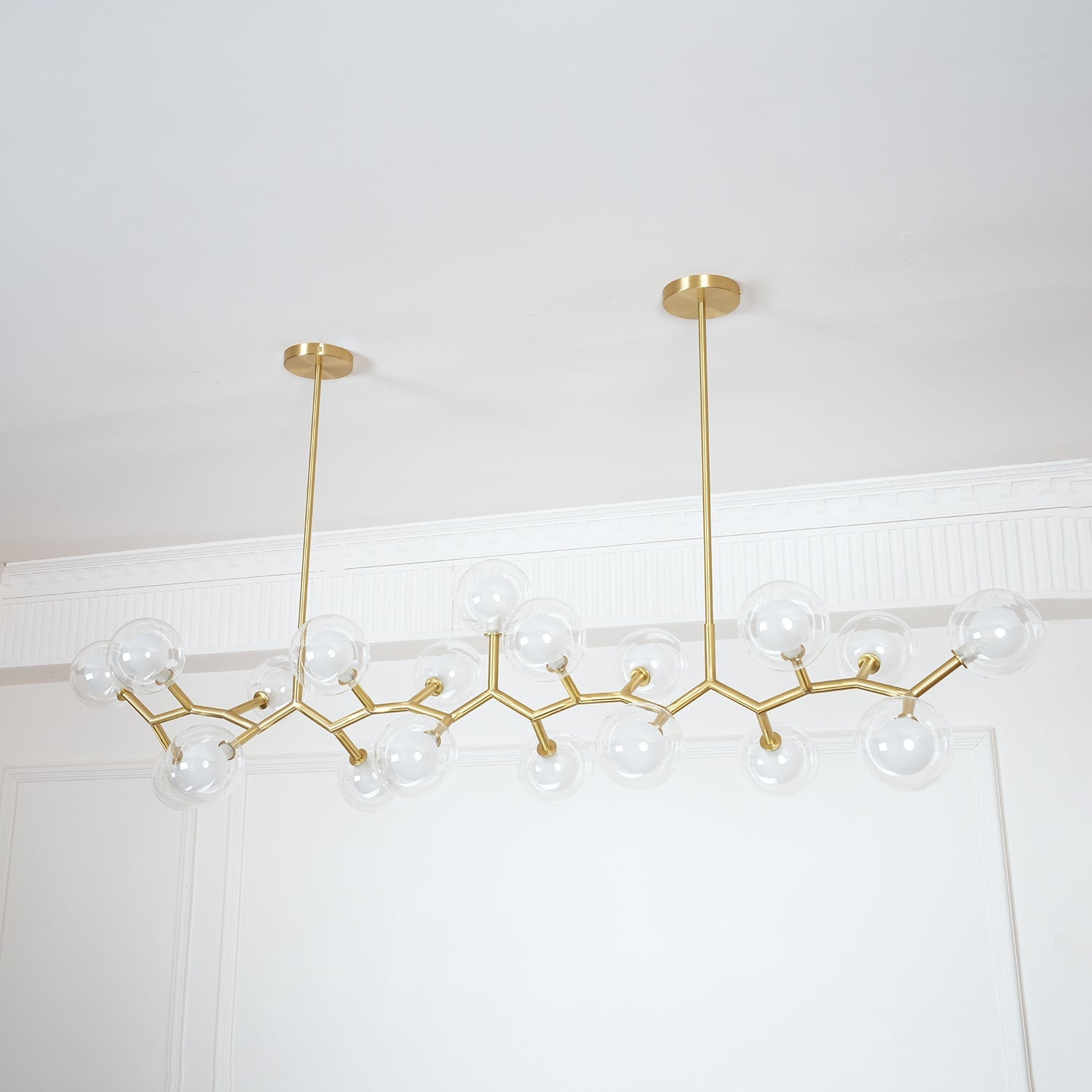 Angled view of the gold branches and two vertical rods