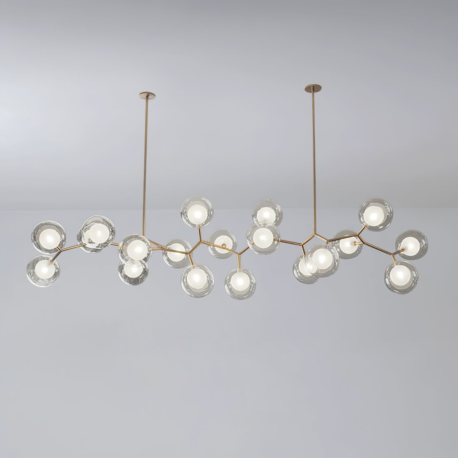 Large branching globe chandelier suspended from two rods