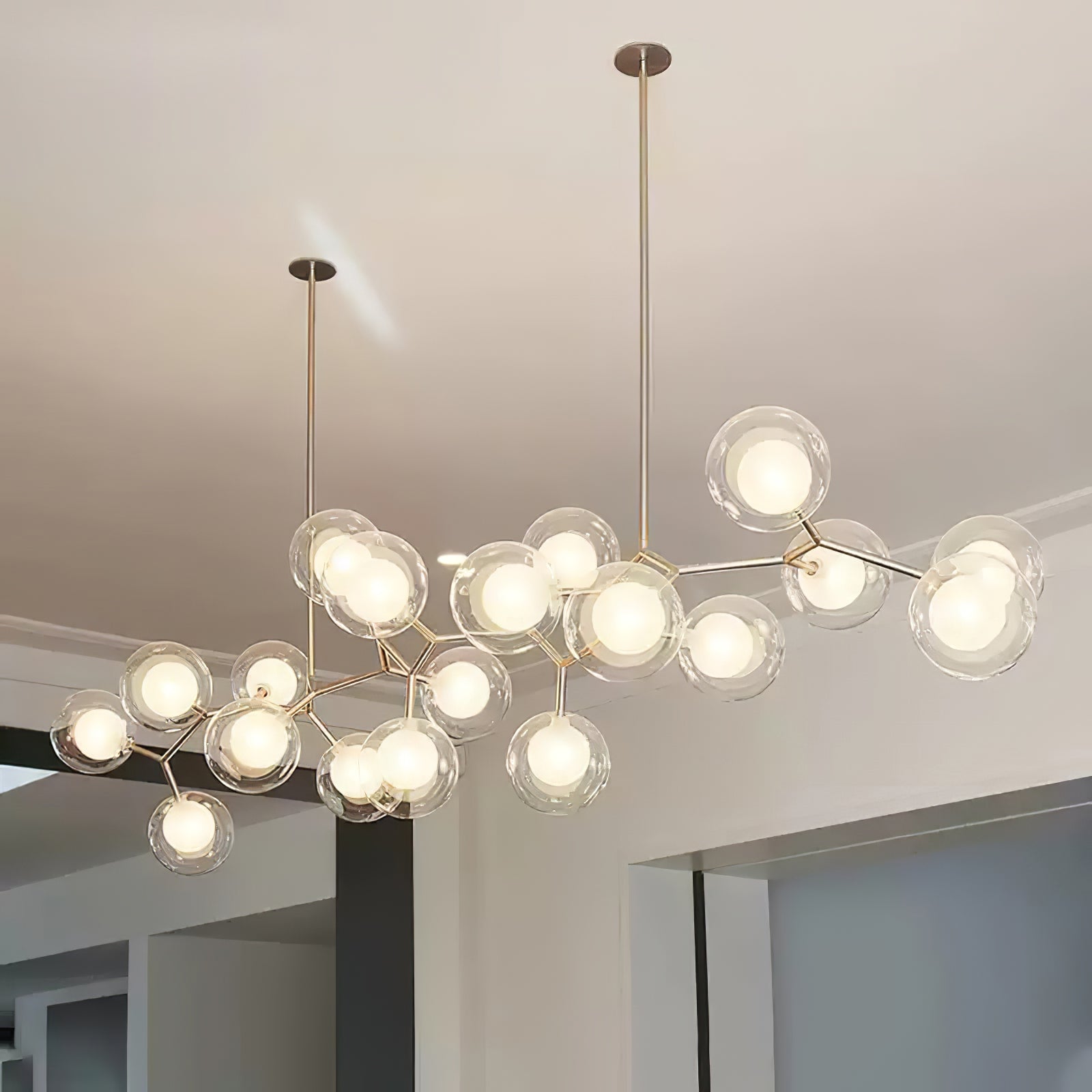 Large illuminated globe chandelier viewed from below