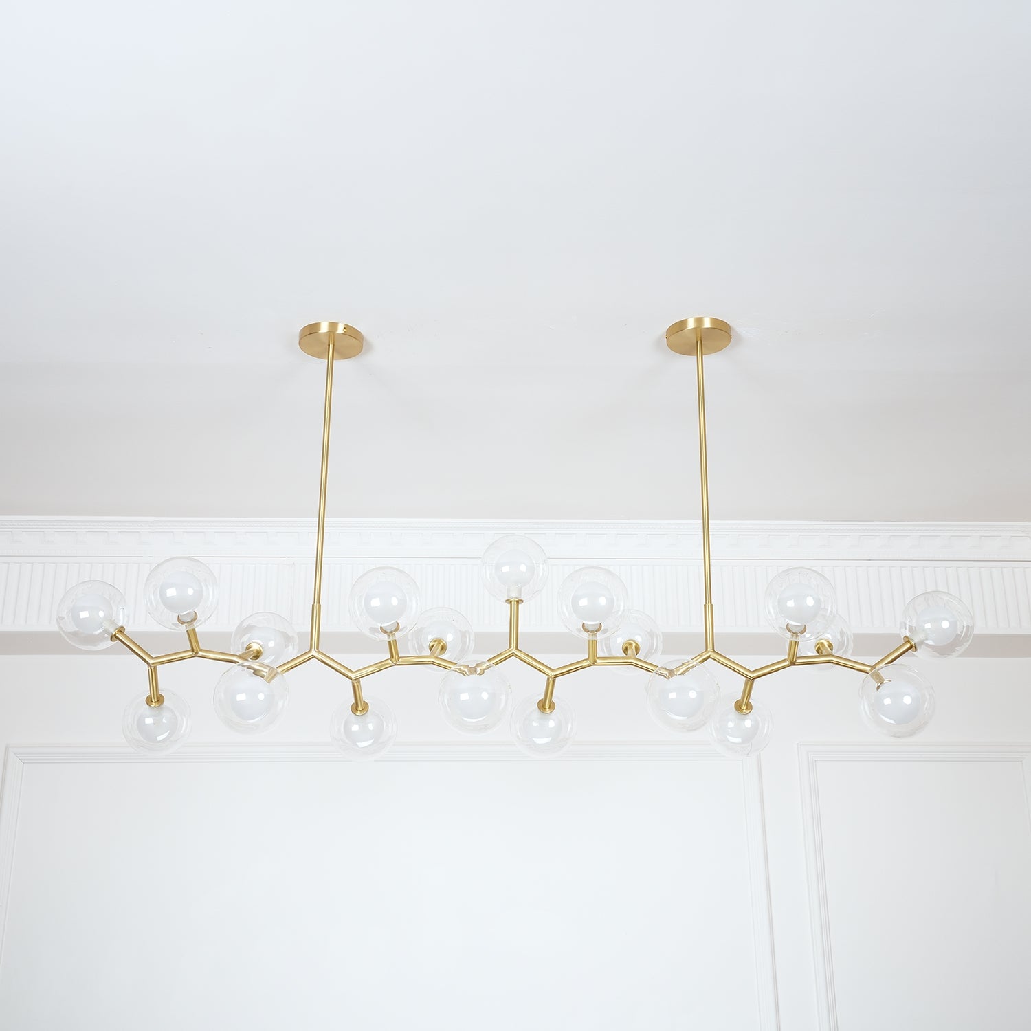 Side view of the unlit chandelier with two suspension rods